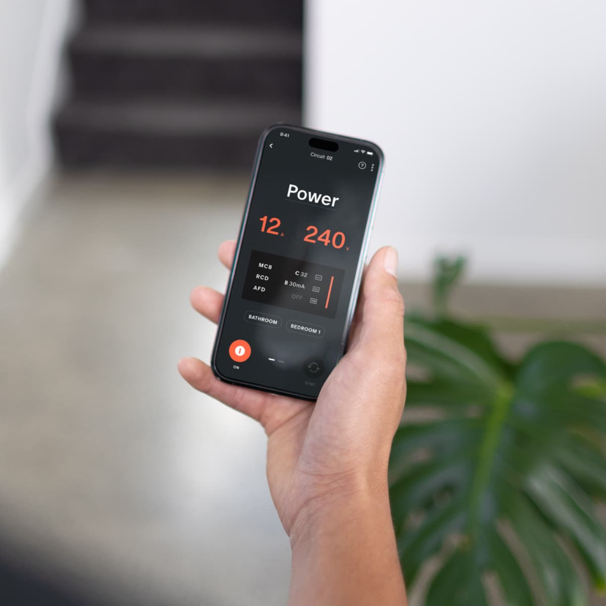 Electrician using the Trade App next to a Basis Board