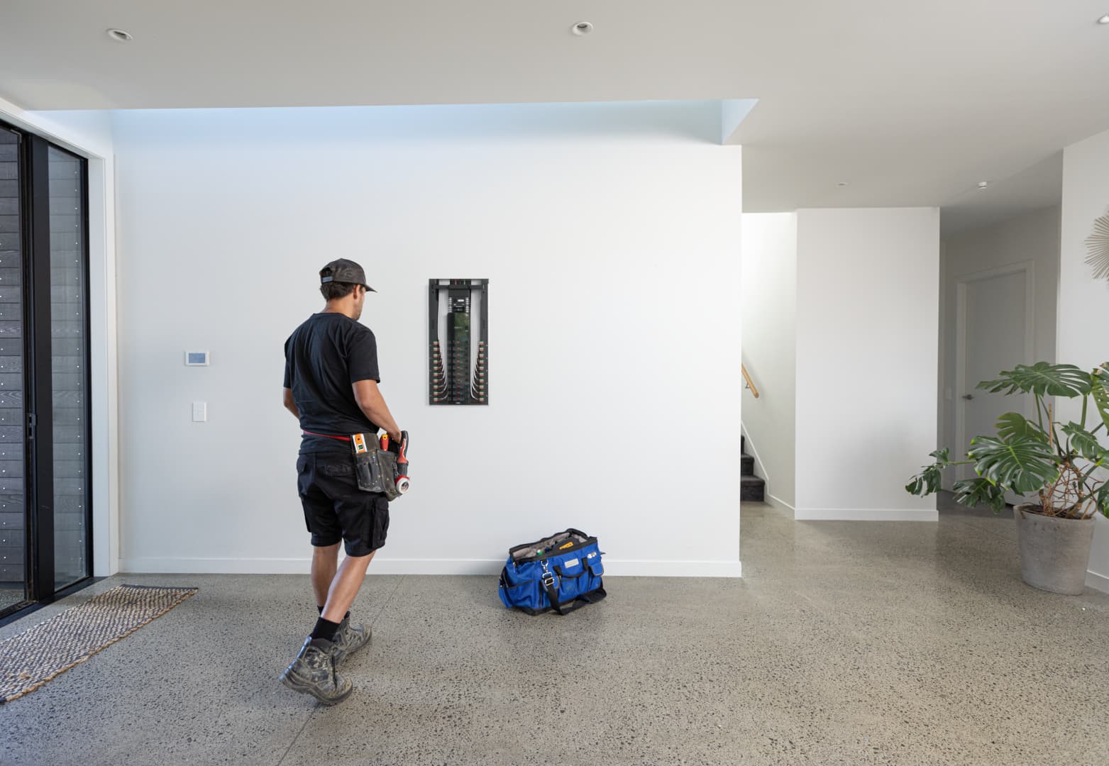 Electrician installing a Basis Board in a new home