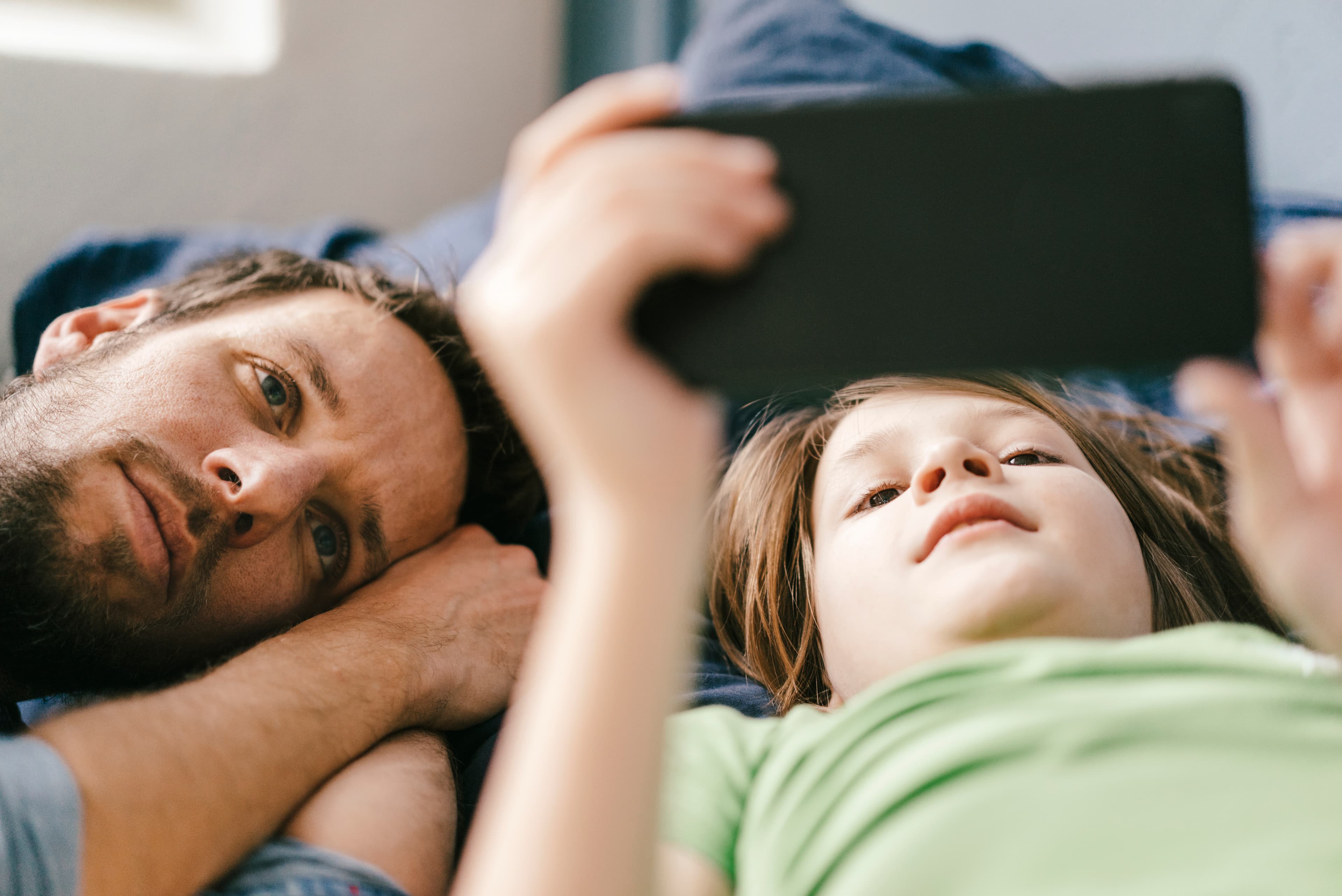 Father and child checking the Basis app together