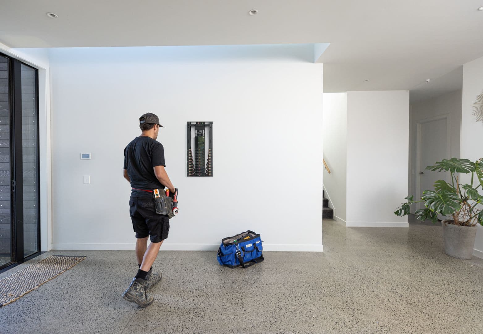Electrician installing a Basis Board in a new home